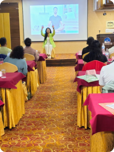 Speaker addressing a workshop audience